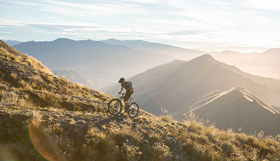 man riding mountain bike with camelbak hydration pack